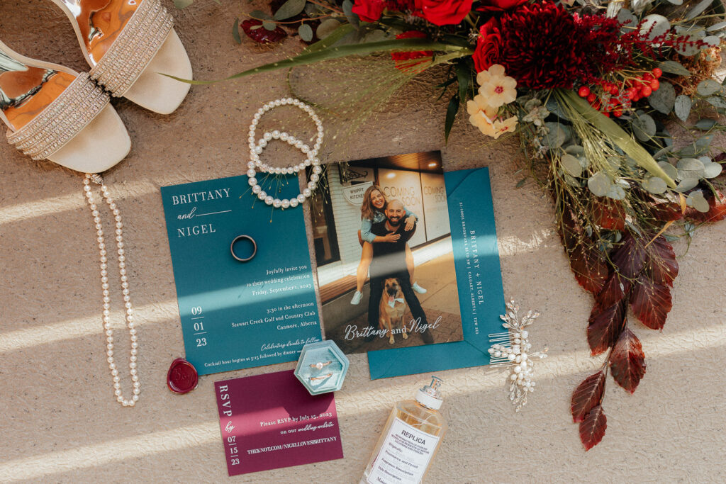 wedding flatlay for a fall stewart creek wedding in canmore, alberta