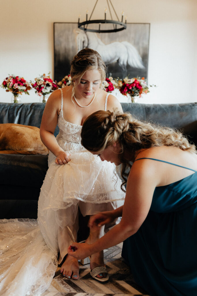 bride putting on shoes