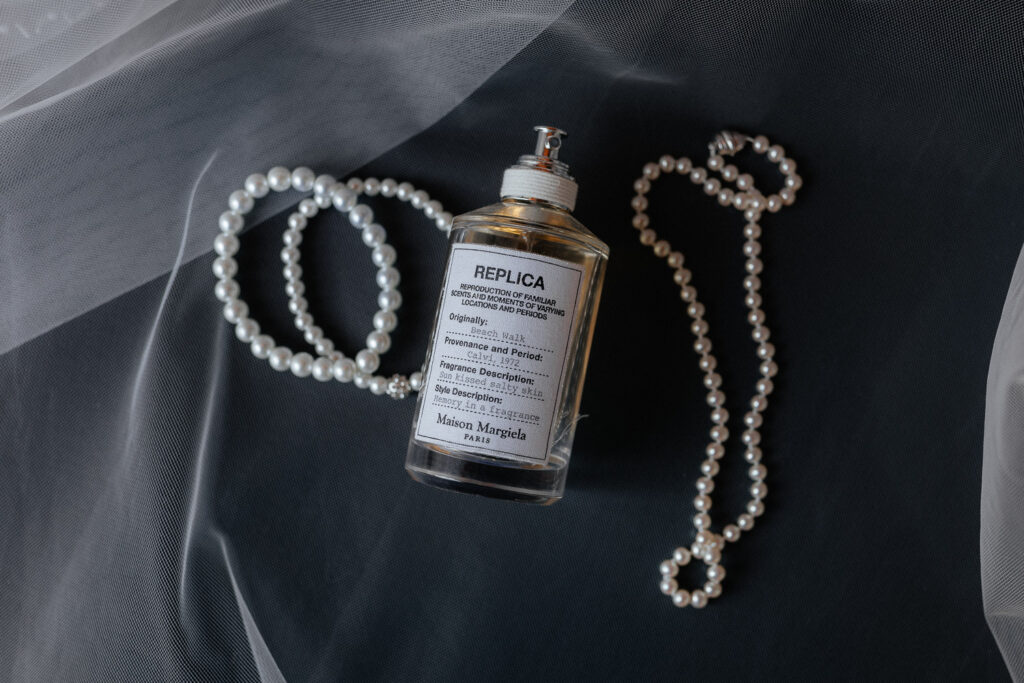 wedding details of perfume and jewlery