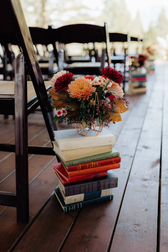 books with flowers on them for a stewart creek wedding in canmore, alberta