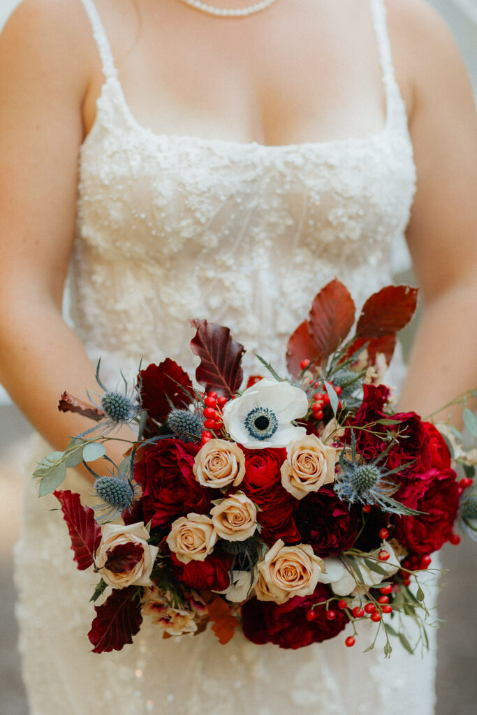 close up of bride bouquet with red roses