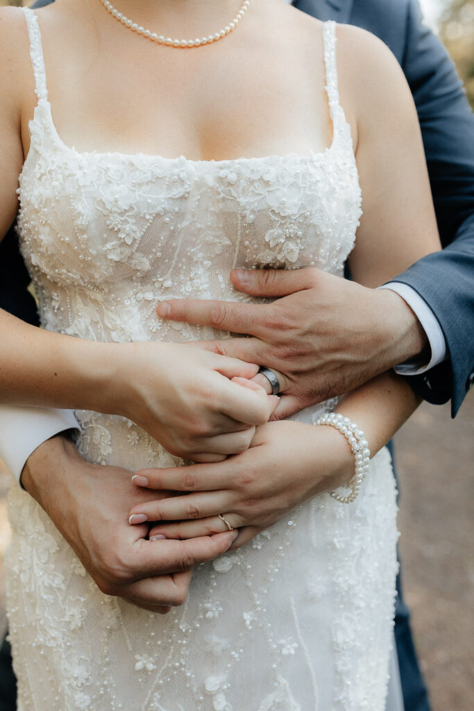 couple putting on their wedding bands